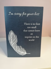Load image into Gallery viewer, Baby loss condolence card, navy background, white text Im sorry for your loss, There is no foot too small that cannot leave an imprint on this world, single white feather design
