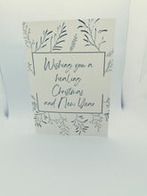 Load image into Gallery viewer, Vilomah. The &#39;Jess&#39; was designed by Vilomah co-founder Jen in honour of her daughter Jess. Our other co-founder Claire design the &#39;Alex&#39; for her daughter.  The Jess Card has a beautiful creamy backgrond with a simple blue foliage motif. The message reads &quot;Wishing you a healing Christmas and New Year&quot;. 

